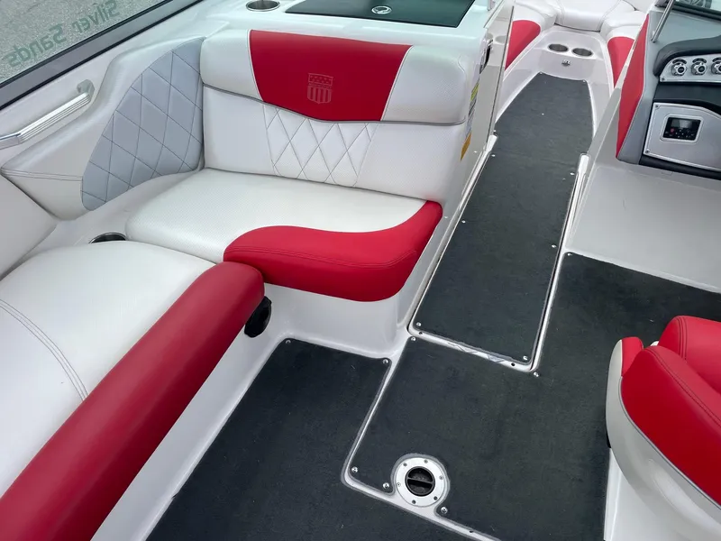 Slide: The Image of 2013 MasterCraft X-14V boat interior with red and white seating. - 4
