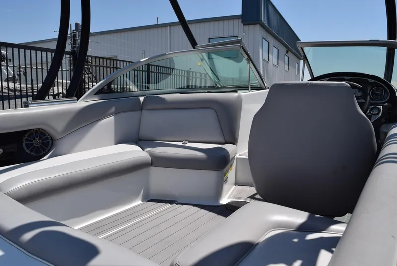 Slide: The Image of 2008 Centurion Elite V C4 Air Warrior boat interior with gray seating and dashboard. - 11