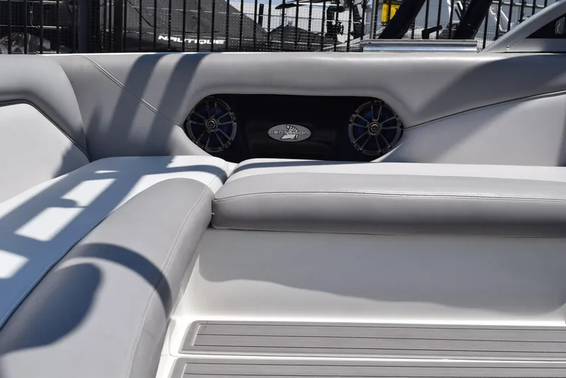 Slide: The Image of Interior of 2008 Centurion Elite V C4 Air Warrior boat with gray seating and speakers. - 14