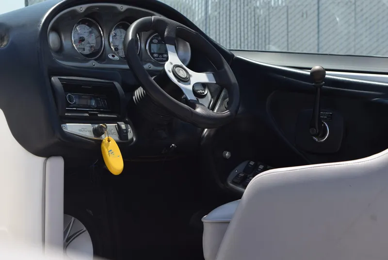 Slide: The Image of 2008 Centurion Elite V C4 Air Warrior boat interior with steering wheel and controls. - 15