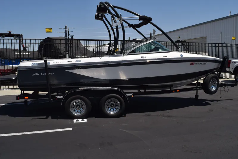 Slide: The Image of 2008 Centurion Elite V C4 Air Warrior boat on trailer, parked outdoors. - 5