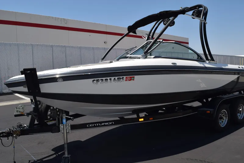 Slide: The Image of 2008 Centurion Elite V C4 Air Warrior boat on trailer, parked outdoors. - 7