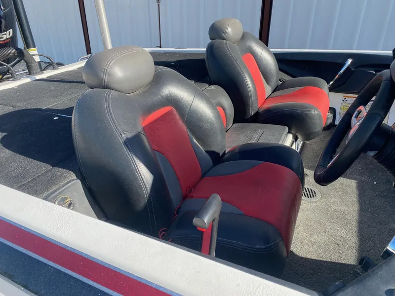 Slide: The Image of 2012 Skeeter FX 20 boat interior with black and red seats. - 10