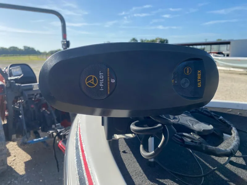 Slide: The Image of 2012 Skeeter FX 20 boat with i-Pilot Ultrex trolling motor in a sunny outdoor setting. - 11