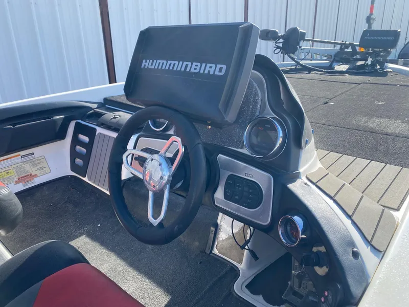 Slide: The Image of 2012 Skeeter FX 20 boat dashboard with Humminbird electronics and steering wheel. - 6