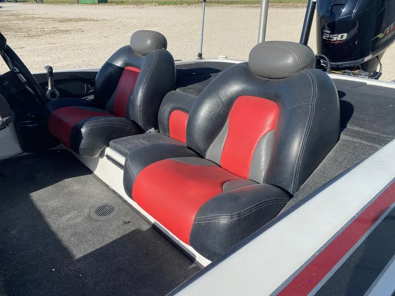 Slide: The Image of 2012 Skeeter FX 20 boat interior with red and black seats, Yamaha 250 engine visible. - 8