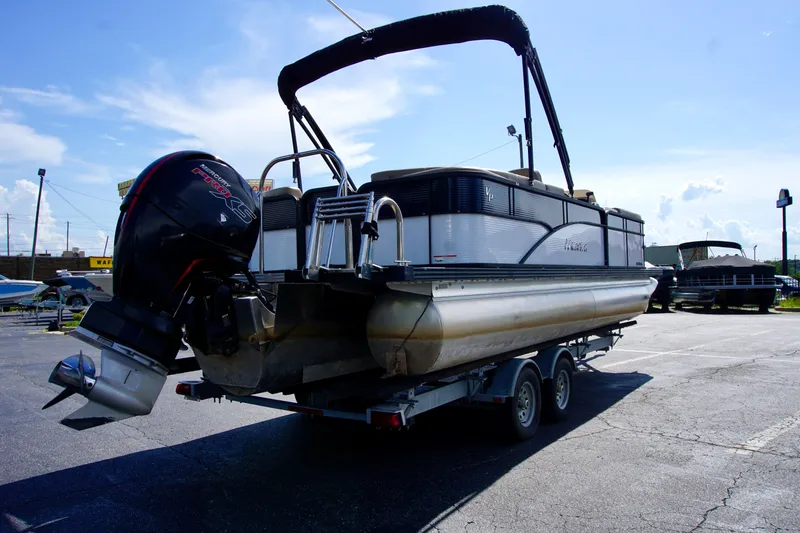 Slide: The Image of 2022 Manitou 23 Aurora LE RF pontoon boat on trailer, rear view. - 3