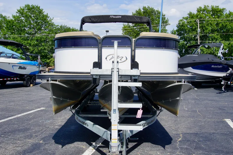 Slide: The Image of 2022 Manitou 23 Aurora LE RF pontoon boat on trailer in parking lot. - 5