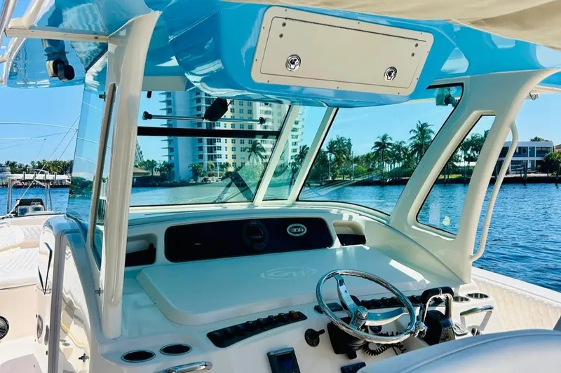 Slide: The Image of 2012 Grady-White Canyon 366 boat helm with waterfront view. - 21