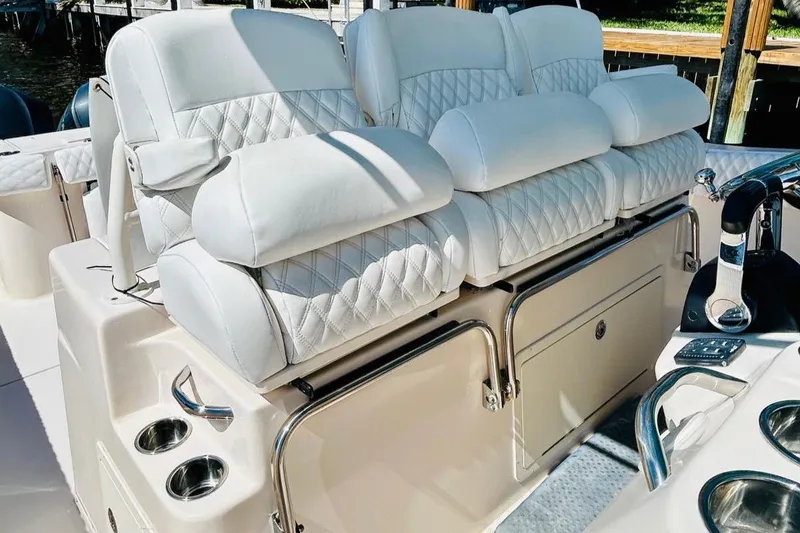 Slide: The Image of Luxurious seating on 2012 Grady-White Canyon 366 boat with quilted white upholstery. - 28