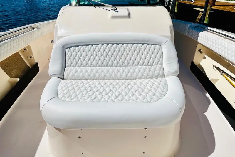 Slide: The Image of 2012 Grady-White Canyon 366 boat with white cushioned seating. - 33