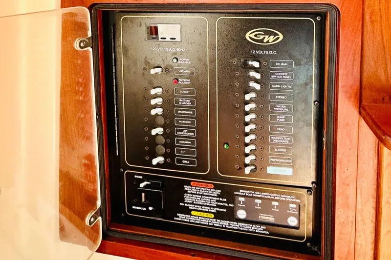 Slide: The Image of Electrical panel of 2012 Grady-White Canyon 366 boat with switches and controls. - 44