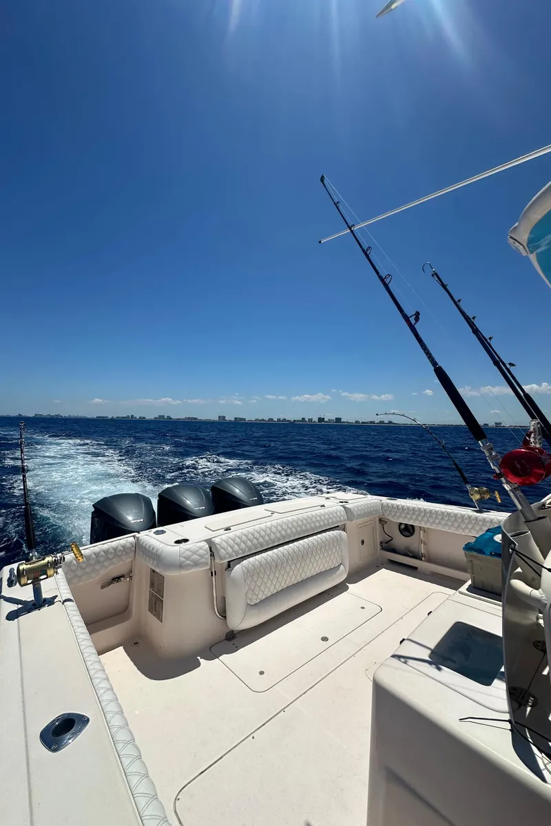 Slide: The Image of 2012 Grady-White Canyon 366 boat on open sea with fishing rods. - 47