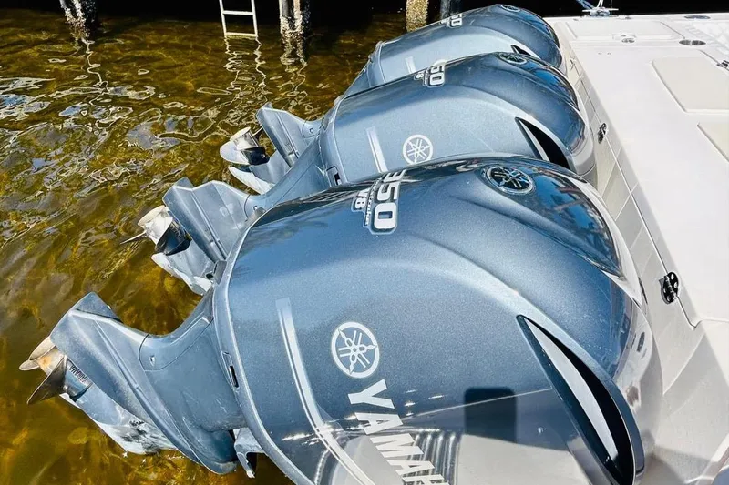 Slide: The Image of Triple Yamaha outboard engines on a 2012 Grady-White Canyon 366 boat. - 5