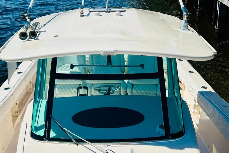 Slide: The Image of 2012 Grady-White Canyon 366 boat with a spacious deck and modern design. - 6