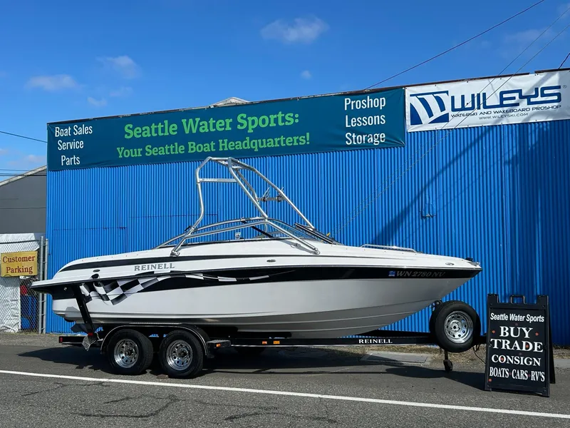 Slide: The Image of 2007 Reinell 220 LSE boat on trailer at Seattle Water Sports dealership. - 0