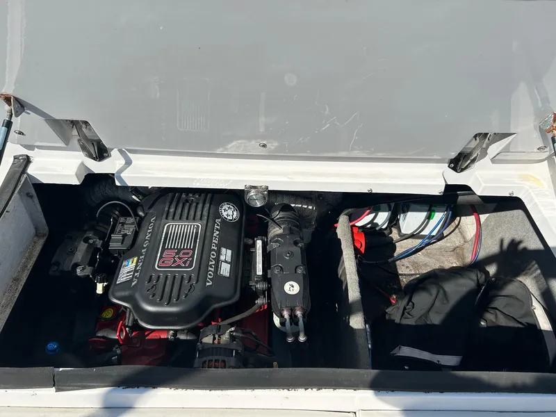 Slide: The Image of Engine compartment of a 2007 Reinell 220 LSE boat, featuring a Volvo Penta engine. - 20