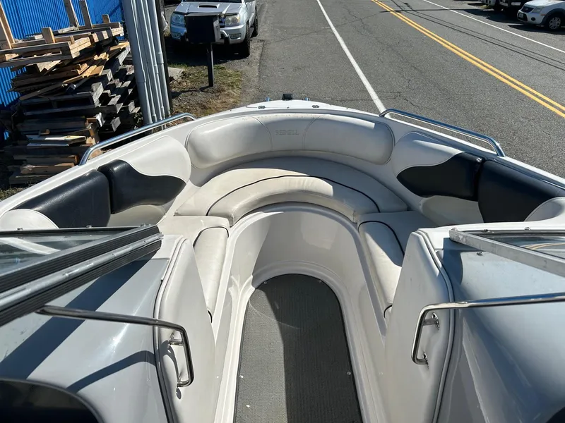 Slide: The Image of 2007 Reinell 220 LSE boat interior with white seating and open bow design. - 5