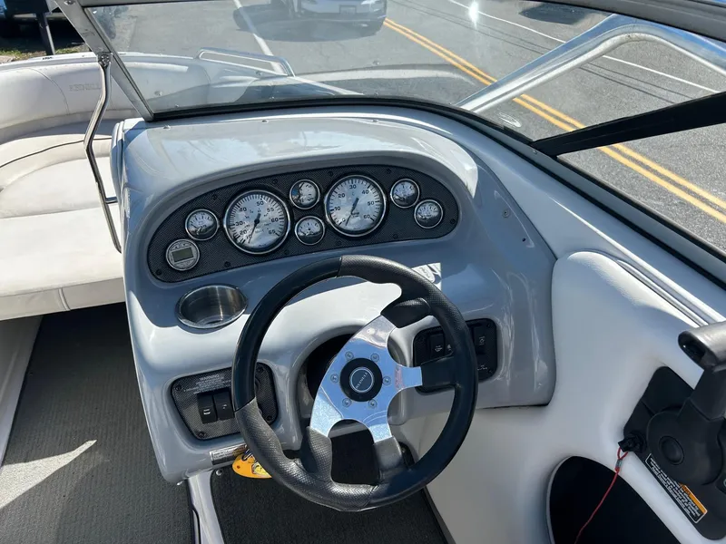 Slide: The Image of 2007 Reinell 220 LSE boat dashboard with steering wheel and instrument panel. - 7