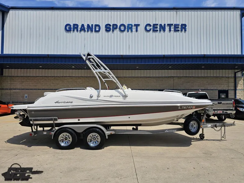 Slide: The Image of 2013 Hurricane SunDeck Sport 202 IO boat on trailer at Grand Sport Center. - 1