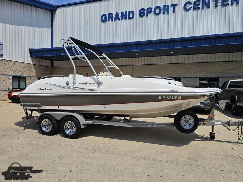 Slide: The Image of 2013 Hurricane SunDeck Sport 202 IO boat on trailer at Grand Sport Center. - 10