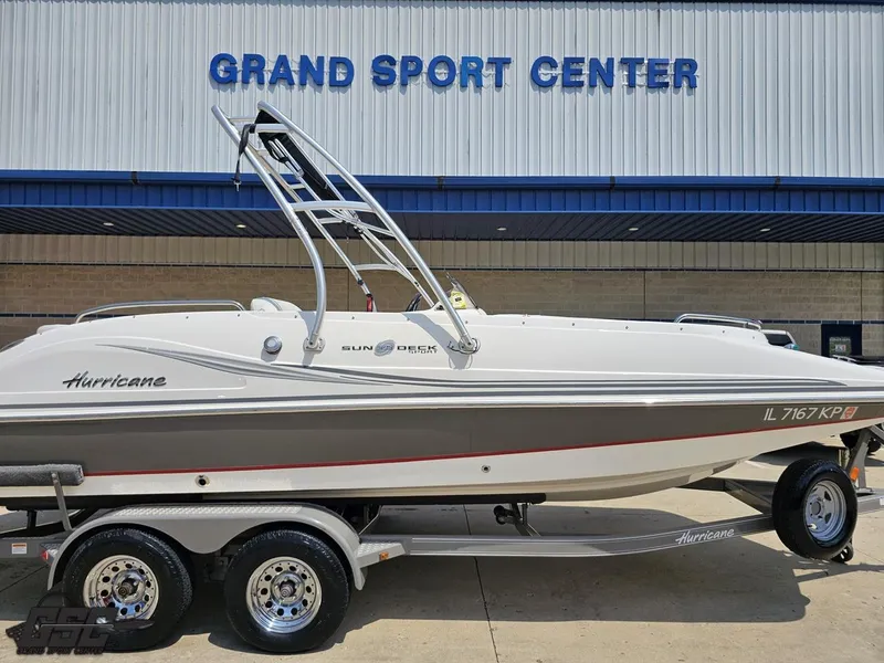 Slide: The Image of 2013 Hurricane SunDeck Sport 202 IO boat on trailer at Grand Sport Center. - 3