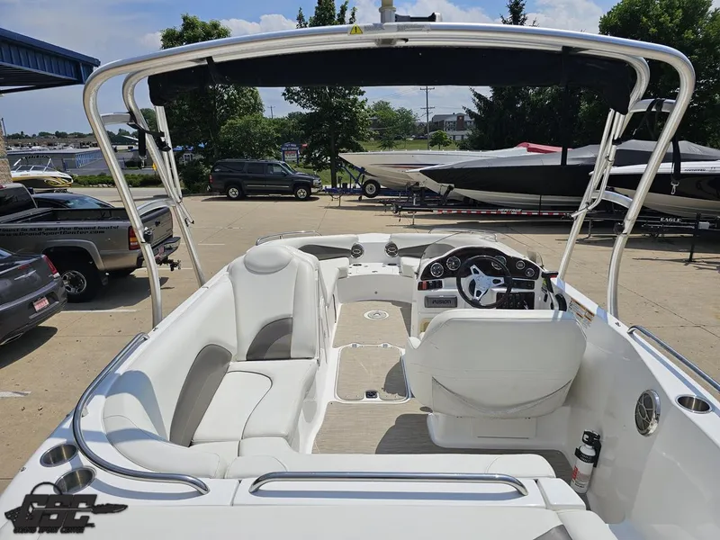 Slide: The Image of 2013 Hurricane SunDeck Sport 202 IO boat interior with seating and steering wheel. - 38