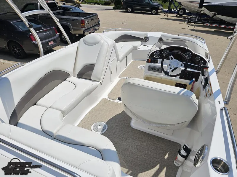 Slide: The Image of 2013 Hurricane SunDeck Sport 202 IO boat interior with white seating and control panel. - 41