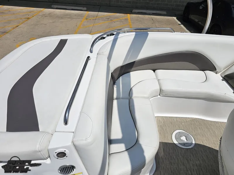 Slide: The Image of 2013 Hurricane SunDeck Sport 202 IO boat interior with white seating and gray accents. - 42