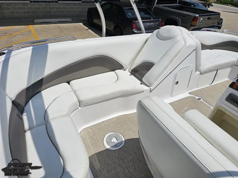 Slide: The Image of 2013 Hurricane SunDeck Sport 202 IO boat interior with white seating and beige flooring. - 43