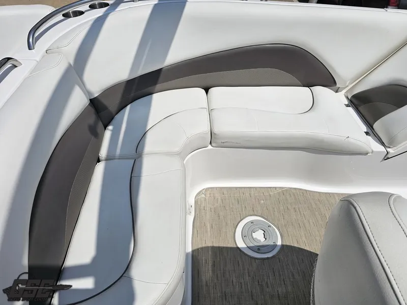 Slide: The Image of 2013 Hurricane SunDeck Sport 202 IO boat interior with white cushioned seating. - 45