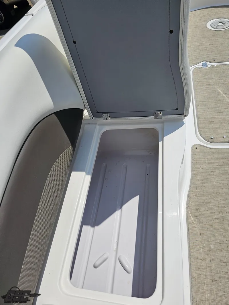 Slide: The Image of Open storage compartment on 2013 Hurricane SunDeck Sport 202 IO boat. - 47