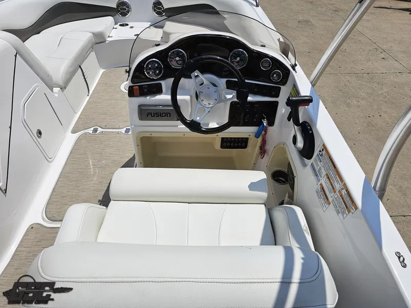 Slide: The Image of 2013 Hurricane SunDeck Sport 202 IO boat interior with steering wheel and seating. - 48