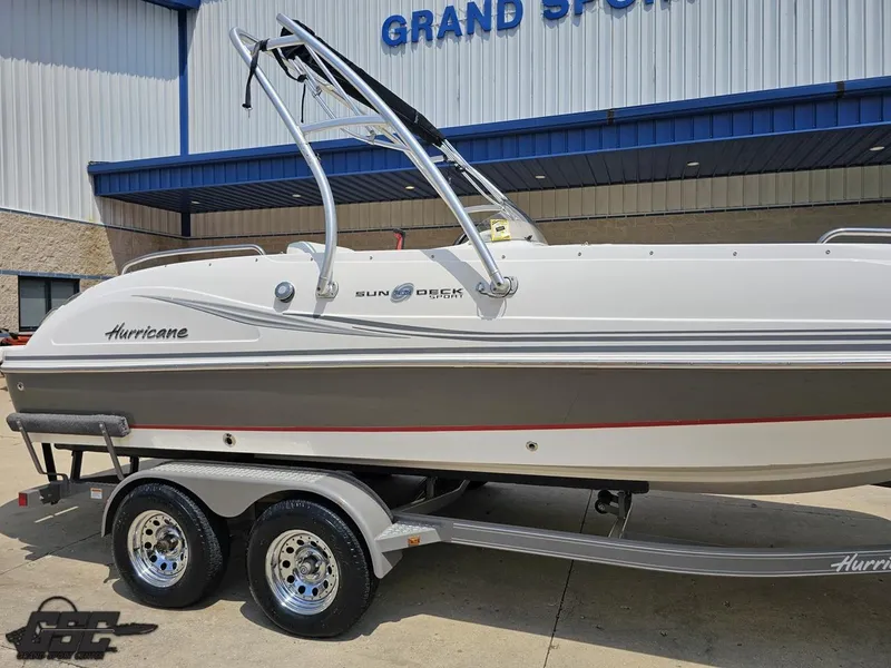Slide: The Image of 2013 Hurricane SunDeck Sport 202 IO boat on trailer outside dealership. - 7