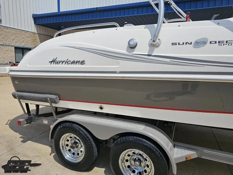 Slide: The Image of 2013 Hurricane SunDeck Sport 202 IO boat on trailer, side view. - 8
