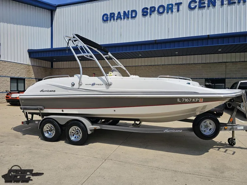 Slide: The Image of 2013 Hurricane SunDeck Sport 202 IO boat on trailer at Grand Sport Center. - 9