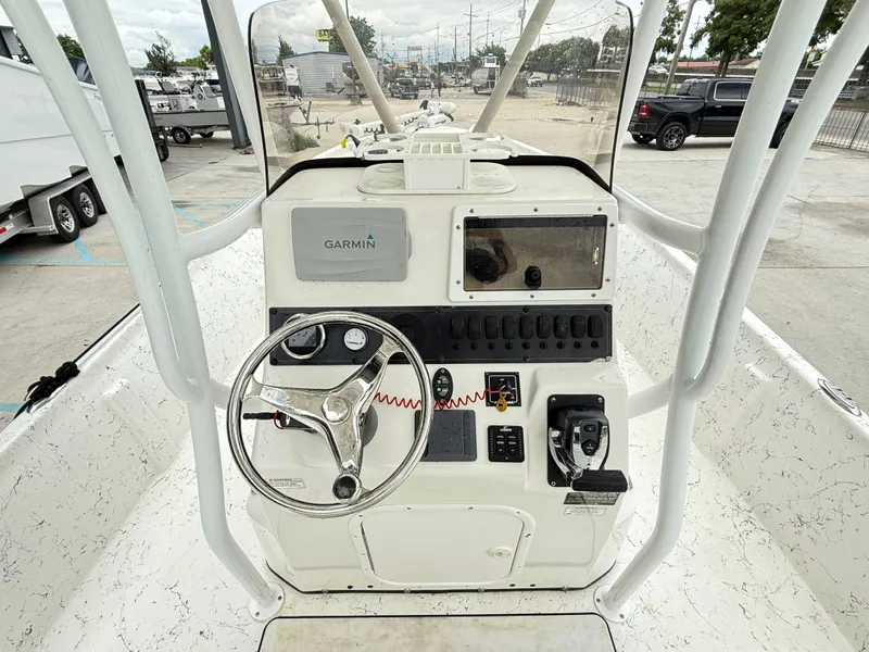 Slide: The Image of 2015 Blazer Bay 2400 boat console with Garmin navigation system and steering wheel. - 10