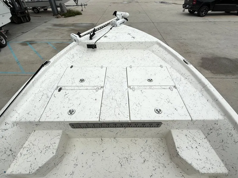 Slide: The Image of 2015 Blazer Bay 2400 boat deck with storage compartments and ruler. - 11