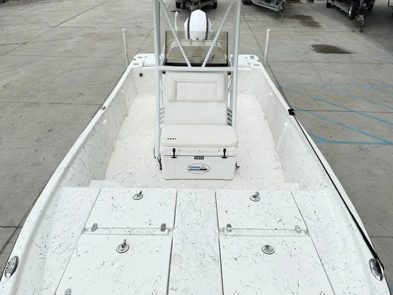 Slide: The Image of 2015 Blazer Bay 2400 boat interior with seating and storage compartments. - 15