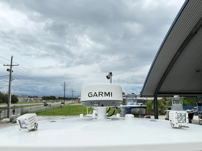 Slide: The Image of 2015 Blazer Bay 2400 boat with Garmin radar, cloudy sky background. - 16