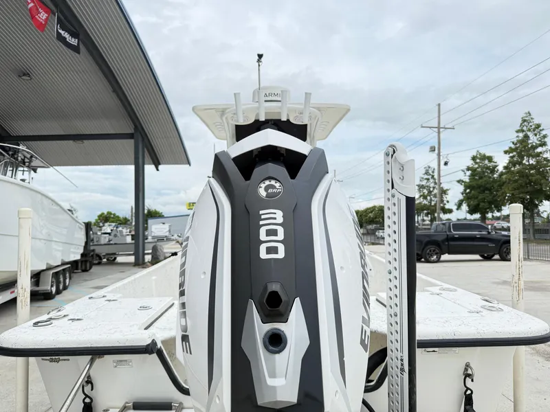 Slide: The Image of 2015 Blazer Bay 2400 boat with Evinrude 300 engine at a dealership. - 5