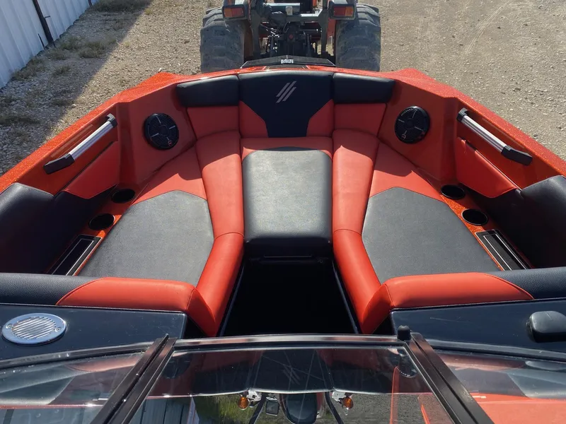 Slide: The Image of 2021 ATX Surf Boats 22 Type-S interior with red and black seating. - 10