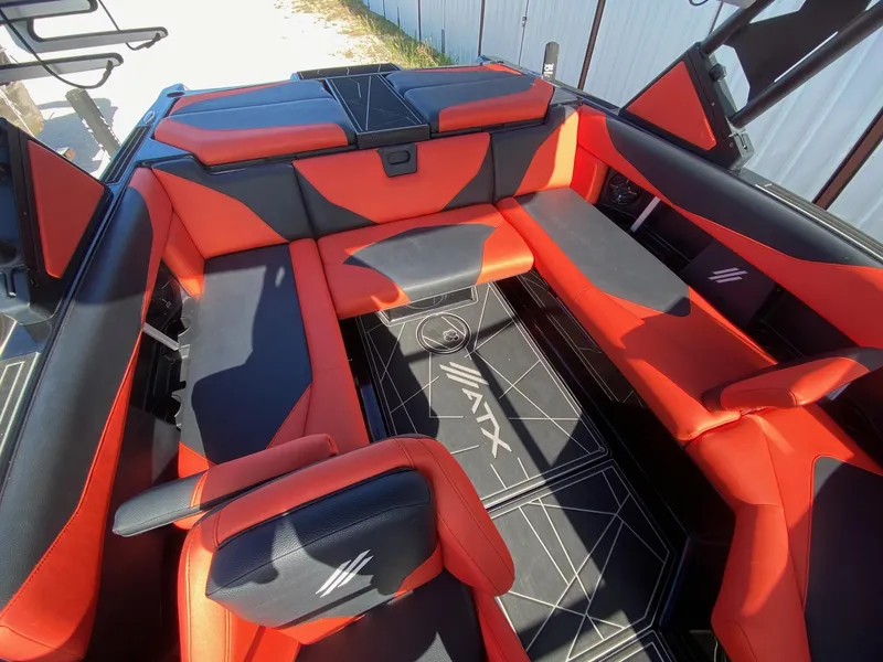 Slide: The Image of 2021 ATX Surf Boats 22 Type-S interior with red and black seating. - 11