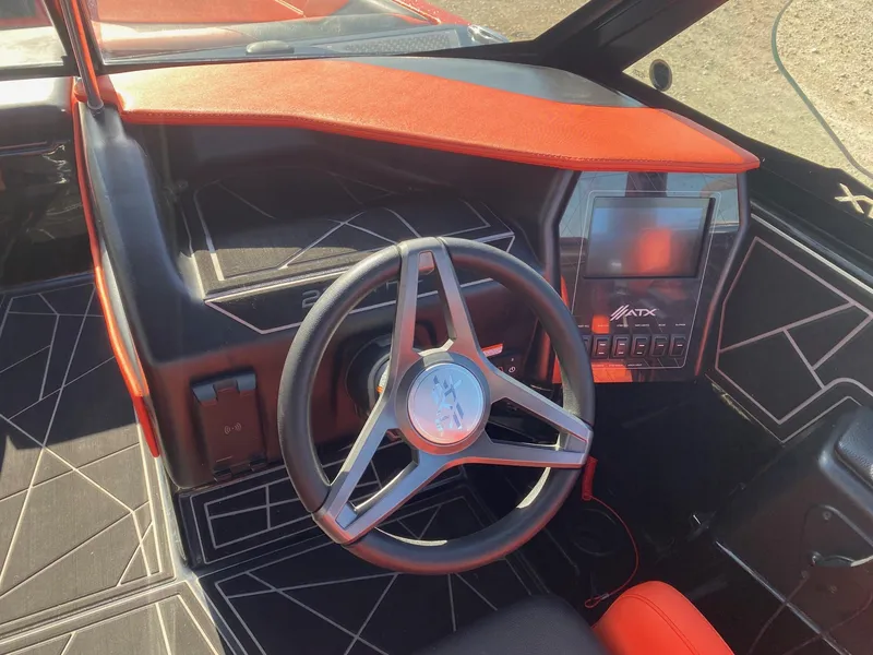Slide: The Image of 2021 ATX Surf Boats 22 Type-S dashboard with steering wheel and touchscreen display. - 7