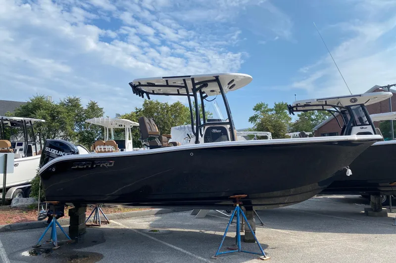 The Image of 2025 Sea Pro 222 Center Console boat on stands, clear sky background. - 0