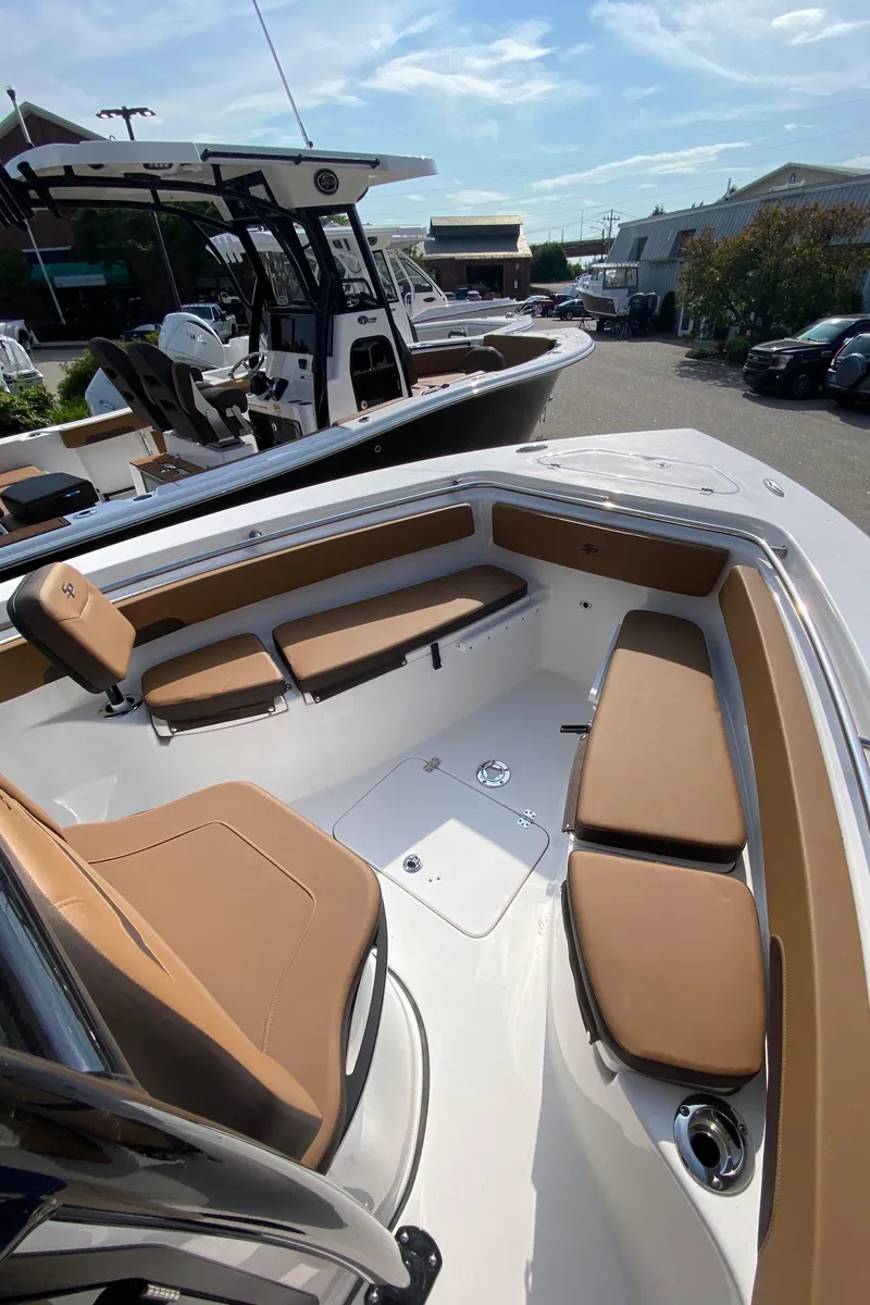 Slide: The Image of 2025 Sea Pro 222 Center Console boat with tan seating and spacious deck. - 10