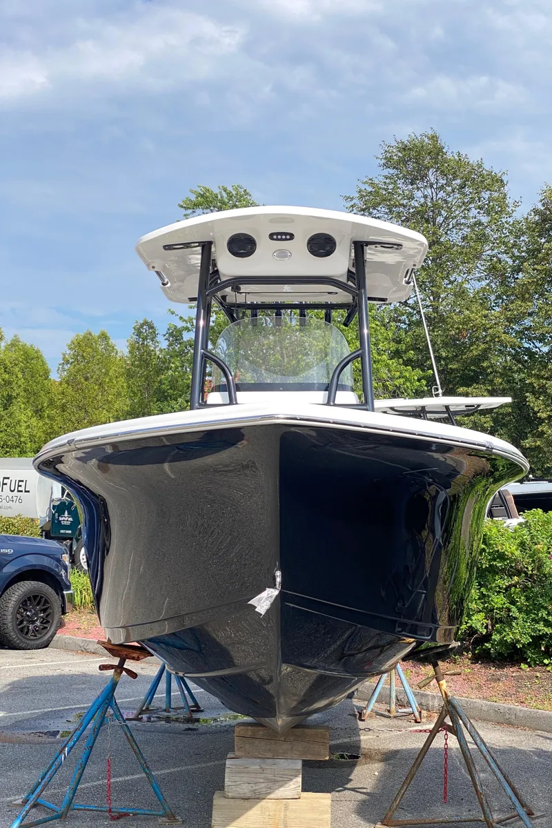 Slide: The Image of 2025 Sea Pro 222 Center Console boat on stands, front view, outdoors. - 4
