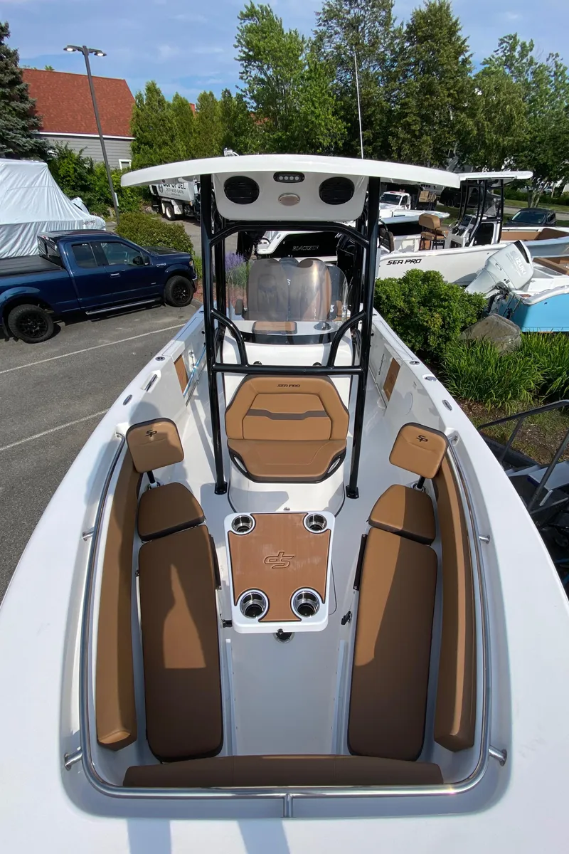 Slide: The Image of 2025 Sea Pro 222 Center Console boat with brown seating and sleek design. - 9