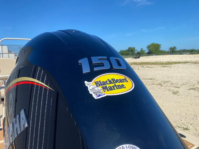 Slide: The Image of Outboard motor with BlackBeard Marine sticker on a 2025 G3 Bay 21 GX boat. - 4