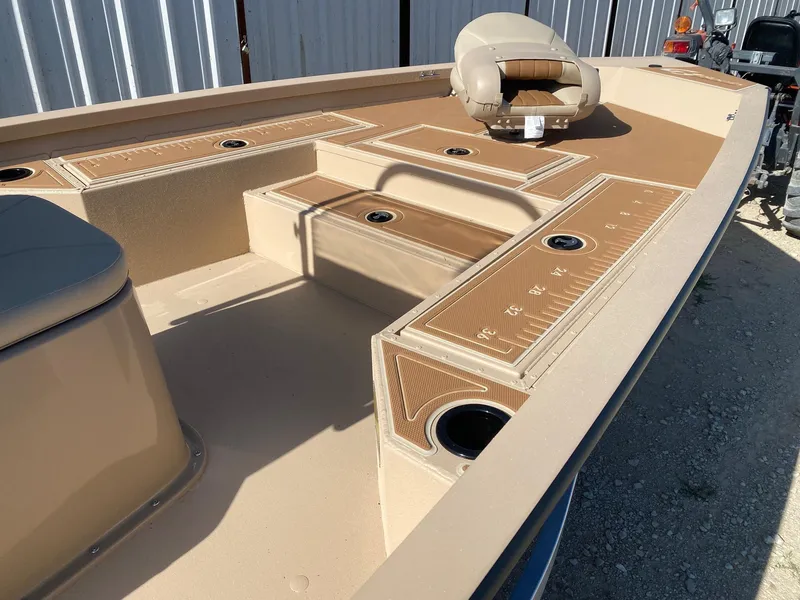 Slide: The Image of 2025 G3 Bay 21 GX boat deck with seating and storage compartments. - 8